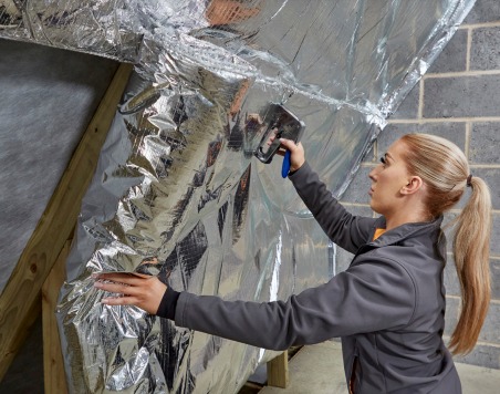 Professional SuperQuilt insulation installation in Scottish home